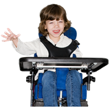 Girl smiling and waving in wheelchair with tray