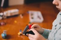 a child playing with LEGO