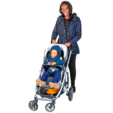 Young person in pushchair with smiling Mother