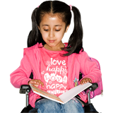 Young girl in wheelchair reading